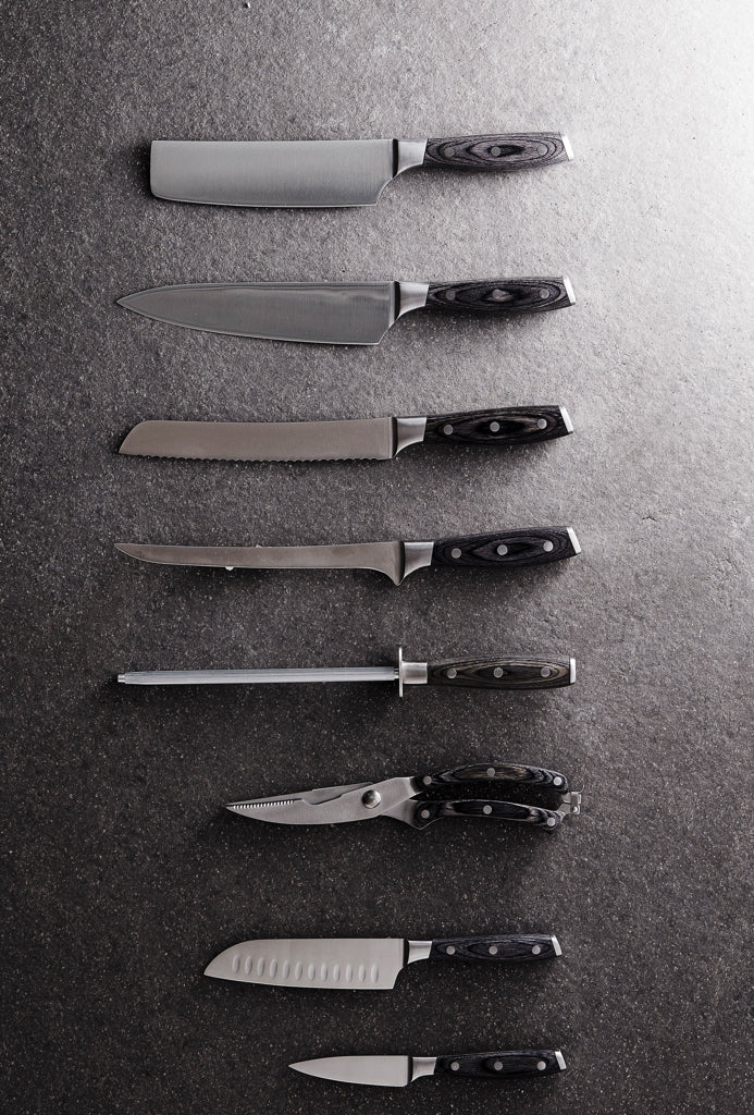 Load image into Gallery viewer, Vinga Kaiser bread knife with a serrated blade for slicing bread, displayed on a kitchen countertop.