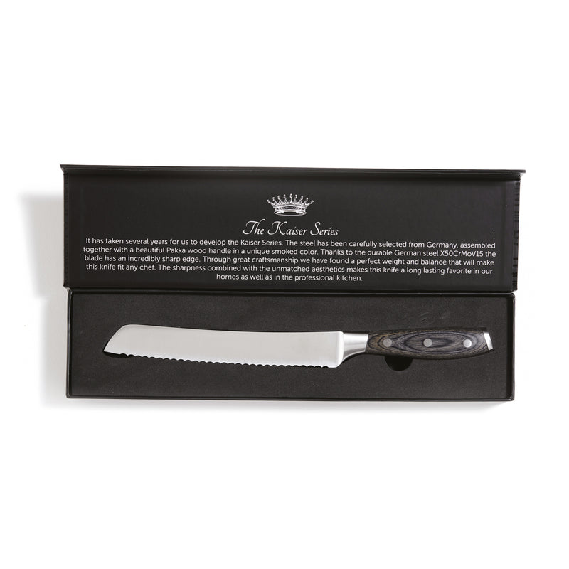 Load image into Gallery viewer, Vinga Kaiser bread knife with serrated edge for easy slicing of bread and baked goods, displayed on a cutting board.