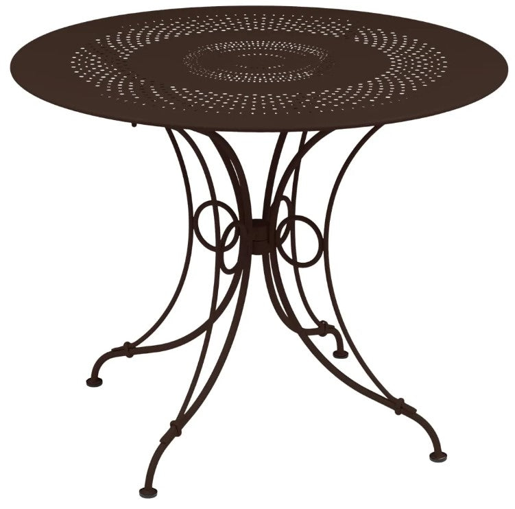 Load image into Gallery viewer, Fermob 1900 outdoor table with 96cm diameter, shown in vibrant color, ideal for outdoor dining or patio settings.