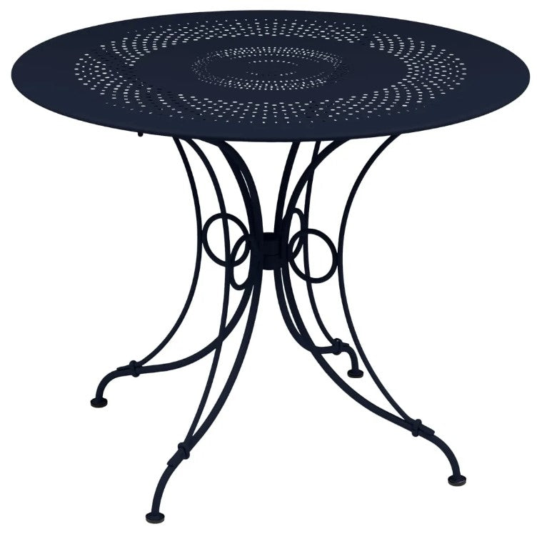 Load image into Gallery viewer, Fermob 1900 outdoor table with 96cm diameter, shown in vibrant color, ideal for garden or patio dining space.