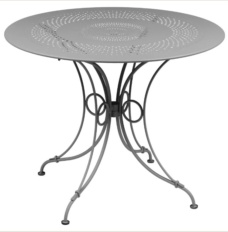 Load image into Gallery viewer, Fermob 1900 outdoor table with 96cm diameter, shown in a vibrant color, ideal for patio or garden dining settings.