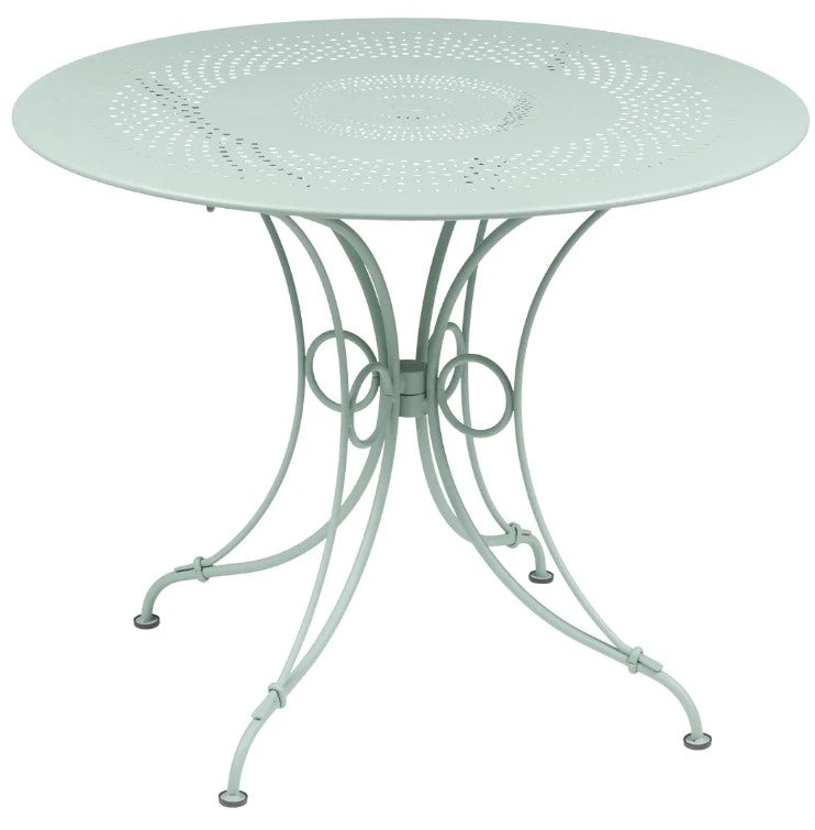 Load image into Gallery viewer, Fermob 1900 outdoor table with a 96cm diameter, shown in vibrant color, suitable for outdoor dining and patio settings.