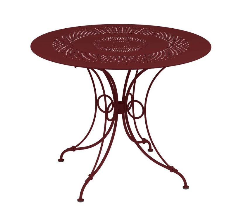 Load image into Gallery viewer, Fermob 1900 outdoor dining table with 96cm diameter in vibrant color, suitable for garden or patio outdoor spaces.