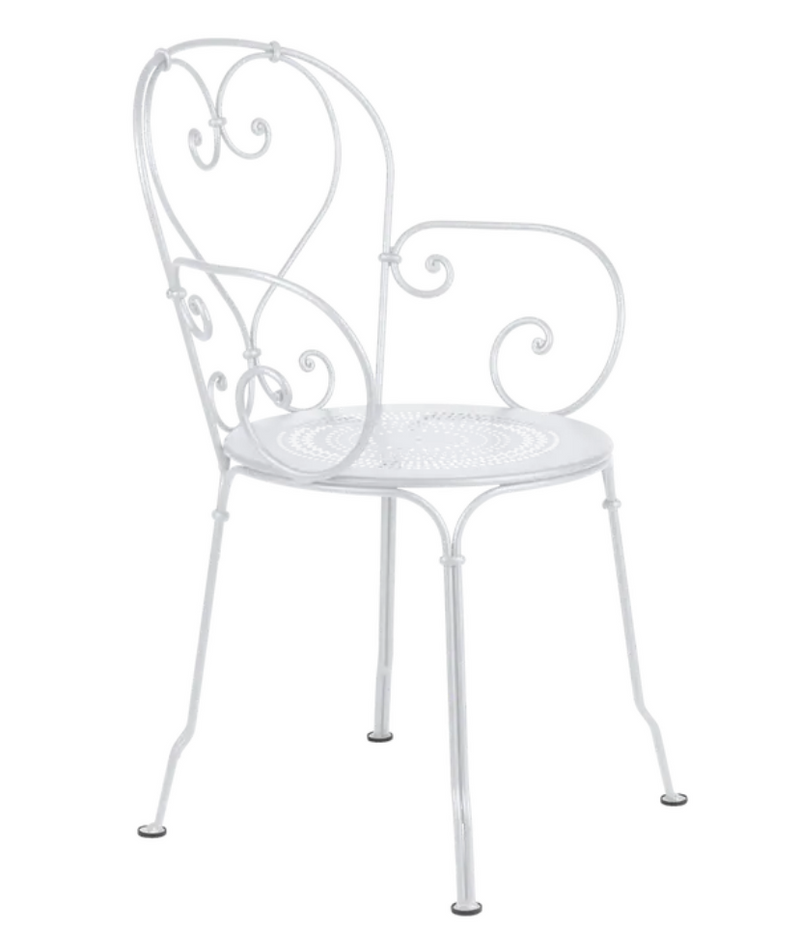Load image into Gallery viewer, Fermob 1900 Lounge Armchair with curved metal frame and woven seat, ideal for outdoor patio relaxation.