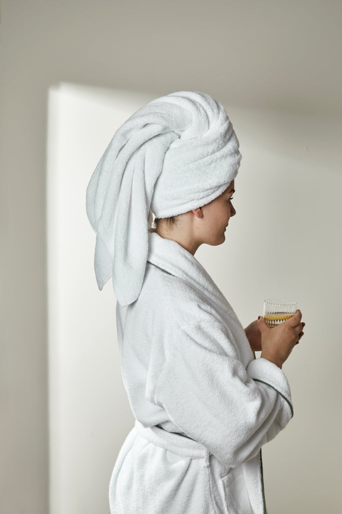 Load image into Gallery viewer, Vinga Harper bathrobe in size L/XL, soft and cozy cotton fabric, shown hanging on a hook in a home setting.