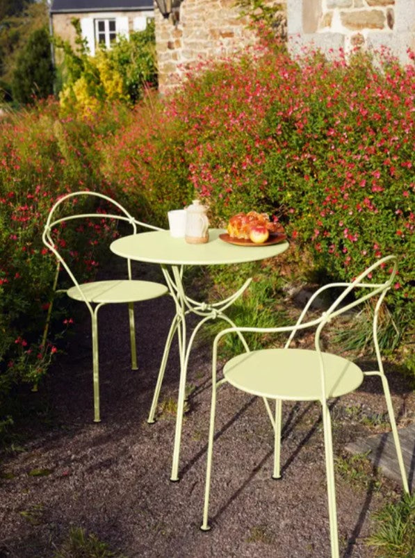 Load image into Gallery viewer, Fermob Airloop Garden Table with a 60cm diameter, sleek round design suitable for cafes, restaurants, or outdoor seating areas.