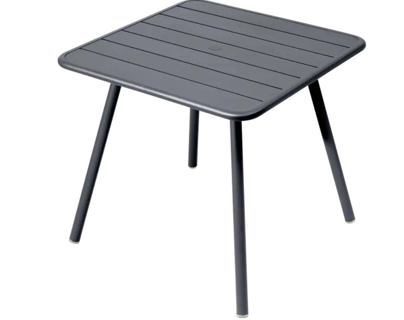 Load image into Gallery viewer, Fermob Luxembourg 4-leg garden table in anthracite metal, 80x80 cm with a sturdy, modern outdoor design.