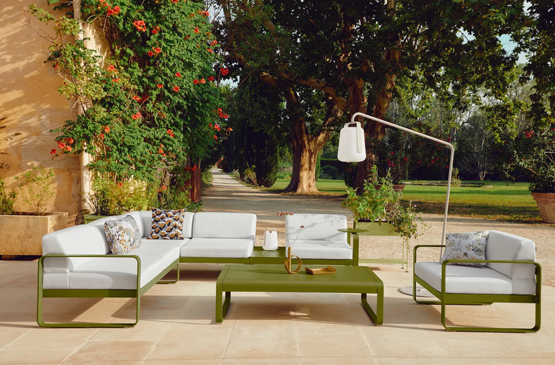 Load image into Gallery viewer, Fermob BALAD² Big Outdoor Lamp, 38 cm tall, spherical design, suitable for outdoor use, illuminated in a modern backyard setting.