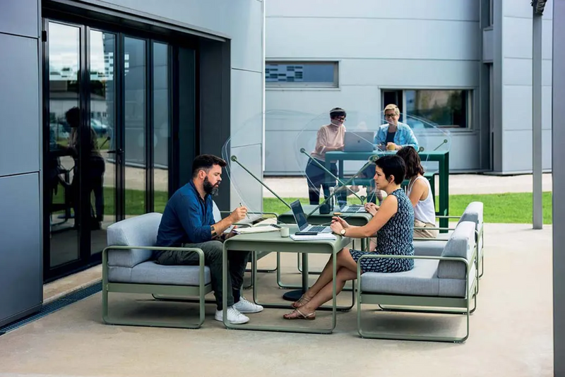 Load image into Gallery viewer, Fermob Bellevie armchair with a sleek metal frame and cushioned seat, ideal for modern indoor or outdoor lounge spaces.
