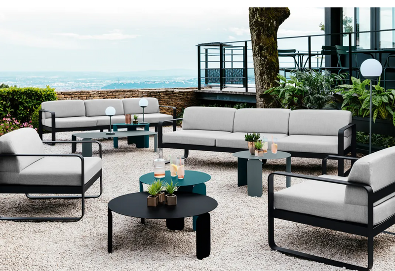 Load image into Gallery viewer, Fermob Bellevie armchair with metal frame and cushioned seat, showcasing a stylish and comfortable seating option for indoor or outdoor use.