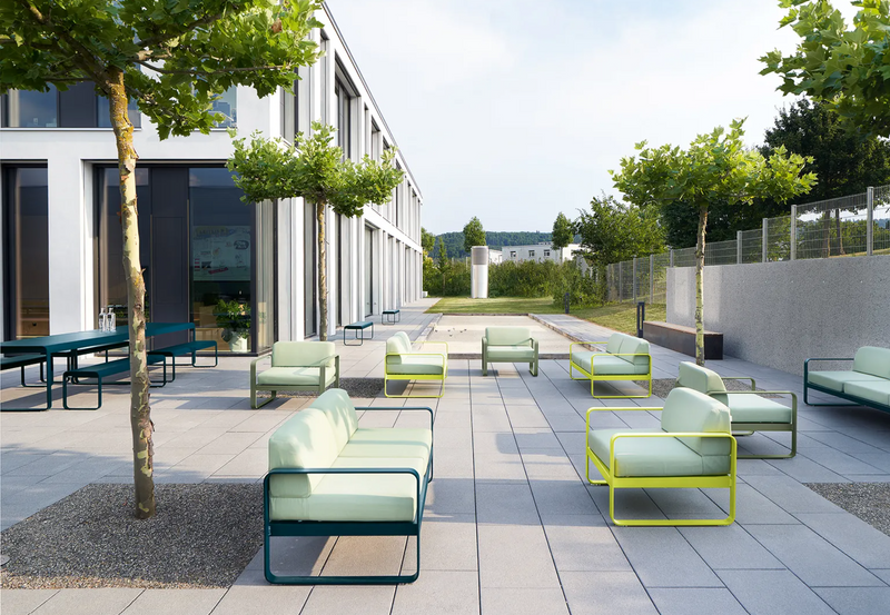 Load image into Gallery viewer, Fermob Bellevie armchair with metal frame and cushioned seat, showcasing its stylish design and comfortable seating.