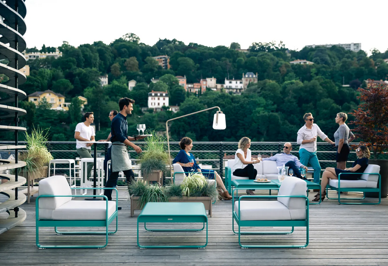 Load image into Gallery viewer, Fermob Bellevie 2-seater outdoor sofa with a sleek design and comfortable cushions, ideal for patio or garden lounging.