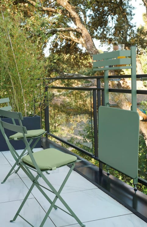 Load image into Gallery viewer, Fermob foldable Bistro Balcony Table set up outdoors on a patio, showcasing compact design for balcony or rooftop use.