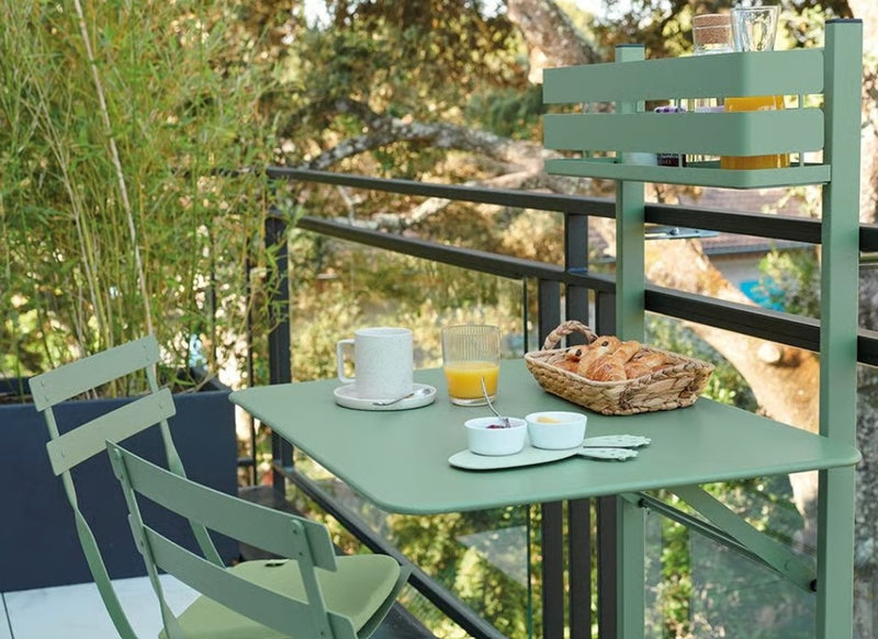 Load image into Gallery viewer, Fermob Bistro Balcony Table, foldable outdoor balcony table on a rooftop patio with a modern design.