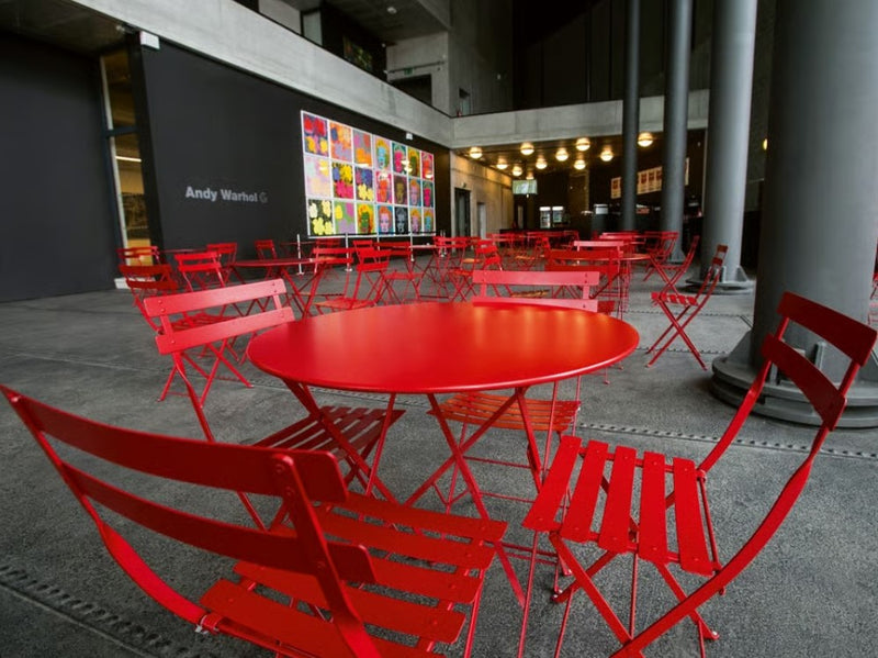 Load image into Gallery viewer, Fermob Bistro Natural Folding Chair with wood and metal frame, suitable for outdoor dining and hospitality settings.