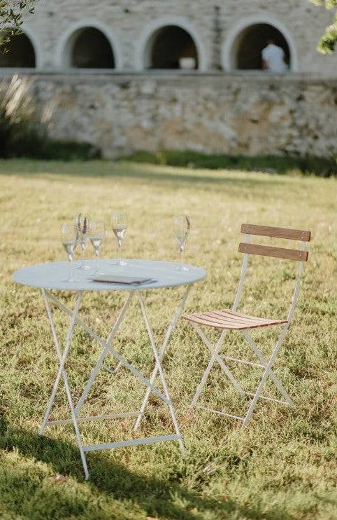 Load image into Gallery viewer, Fermob Bistro Natural Folding Chair with wooden seat and metal frame, ideal for outdoor dining and hospitality settings.