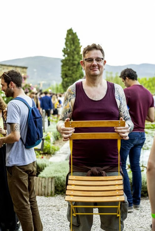 Load image into Gallery viewer, Fermob Bistro Natural folding chair with wood seat and metal frame, ideal for outdoor restaurant or hotel patio seating.