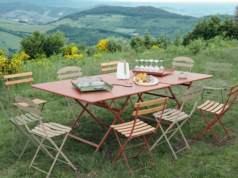 Load image into Gallery viewer, Fermob Bistro Natural folding chair with wooden seat and metal frame, outdoor furniture suitable for hospitality and restaurant settings.