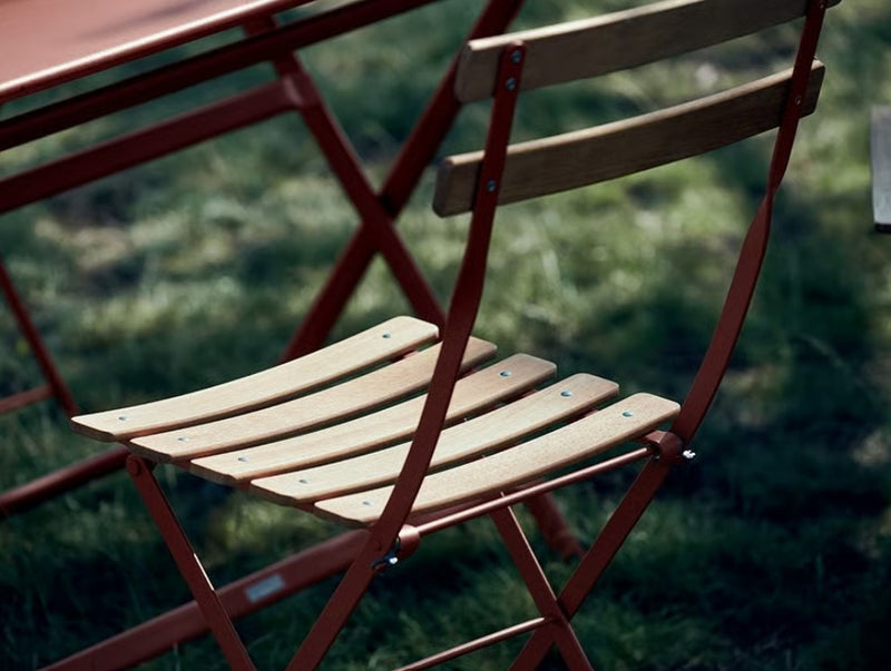 Load image into Gallery viewer, Fermob Bistro Natural folding chair with wooden seat and metal frame, ideal for outdoor restaurant and bistro settings.