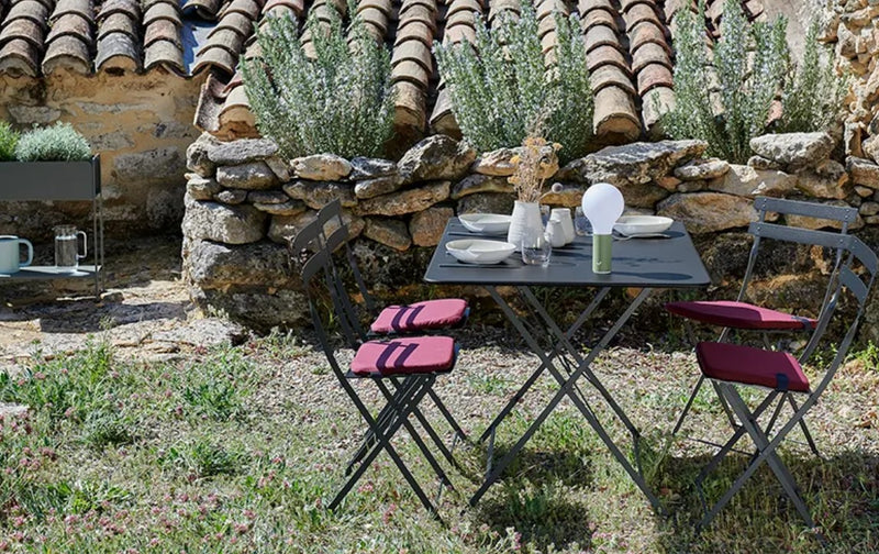 Load image into Gallery viewer, Fermob foldable bistro table, 117 x 77 cm, outdoor hospitality furniture with a stylish, durable design for restaurant or garden use.