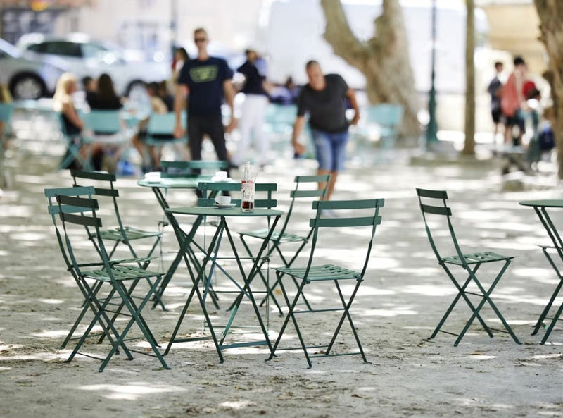 Load image into Gallery viewer, Fermob foldable bistro table 97x57 cm with hole for outdoor dining, ideal for hospitality and restaurant settings.