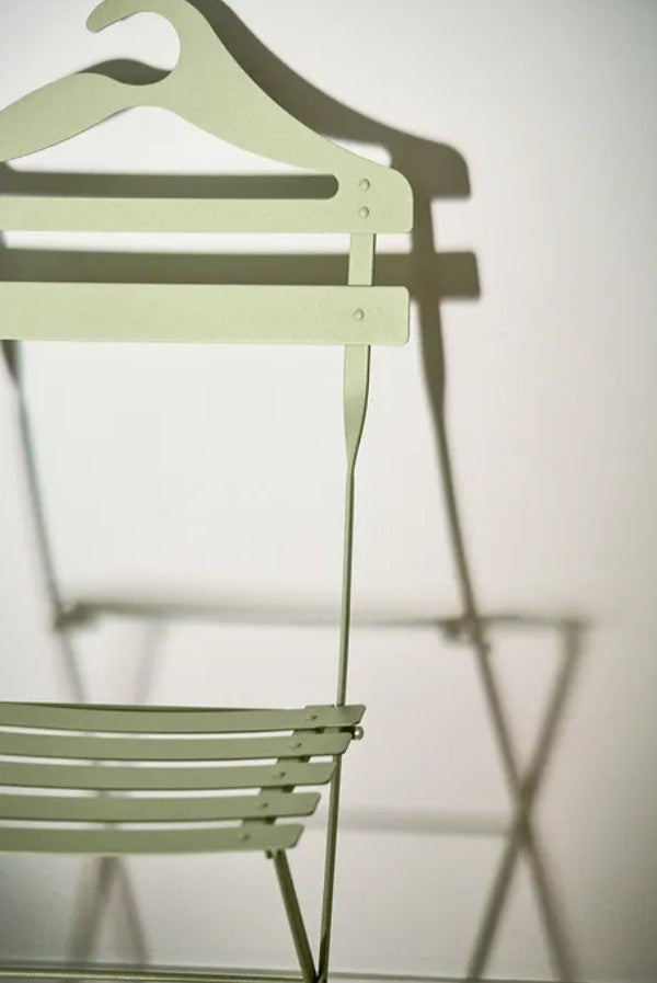 Load image into Gallery viewer, Fermob Bistro Valet Folding Chair in outdoor setting, showcasing durable metal frame and classic design for restaurant or garden use.