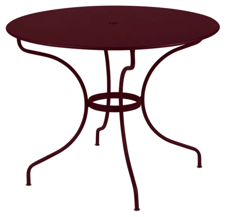 Load image into Gallery viewer, Black Fermob OPÉRA+ outdoor metal table with 96 cm diameter, designed for five-seater patio dining in black cherry finish.