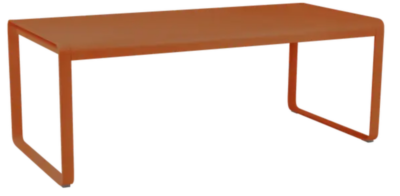 Load image into Gallery viewer, Fermob Bellevie outdoor metal dining table in Candied Orange, 196x90 cm, eight-seater for patio or garden dining.
