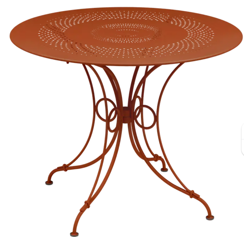Load image into Gallery viewer, Fermob 1900 outdoor table with a 96cm diameter, round design, featuring a candied orange finish and metal construction.