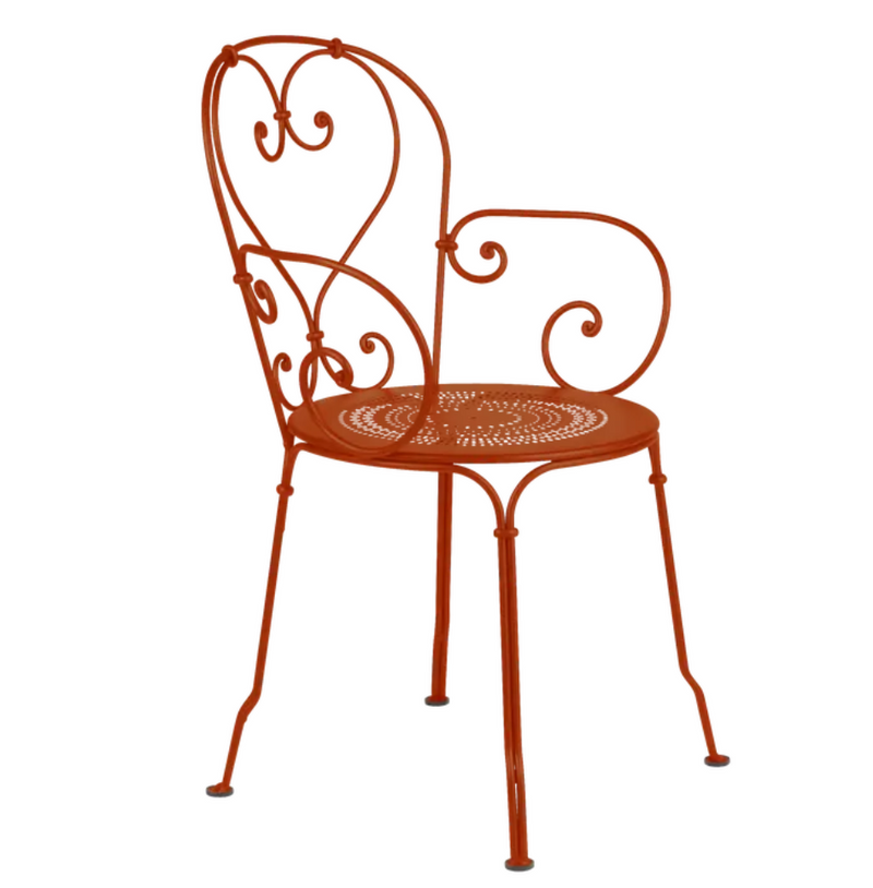 Load image into Gallery viewer, Candied orange Fermob 1900 Lounge Armchair with curved metal frame and cushioned seat, ideal for outdoor patio lounging.