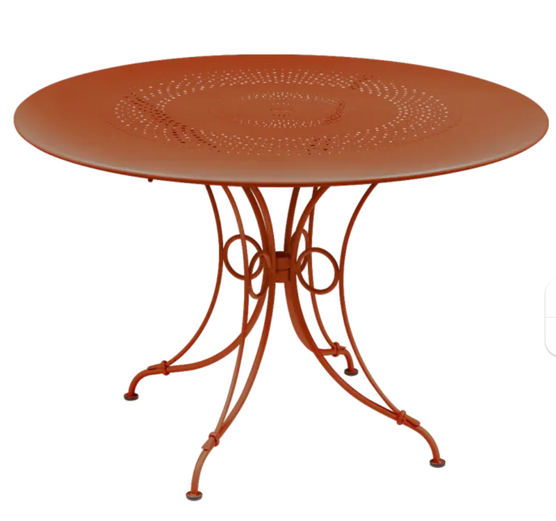 Load image into Gallery viewer, Fermob 1900 outdoor round table with 117 cm diameter in Candied Orange, ideal for outdoor patio or garden spaces.