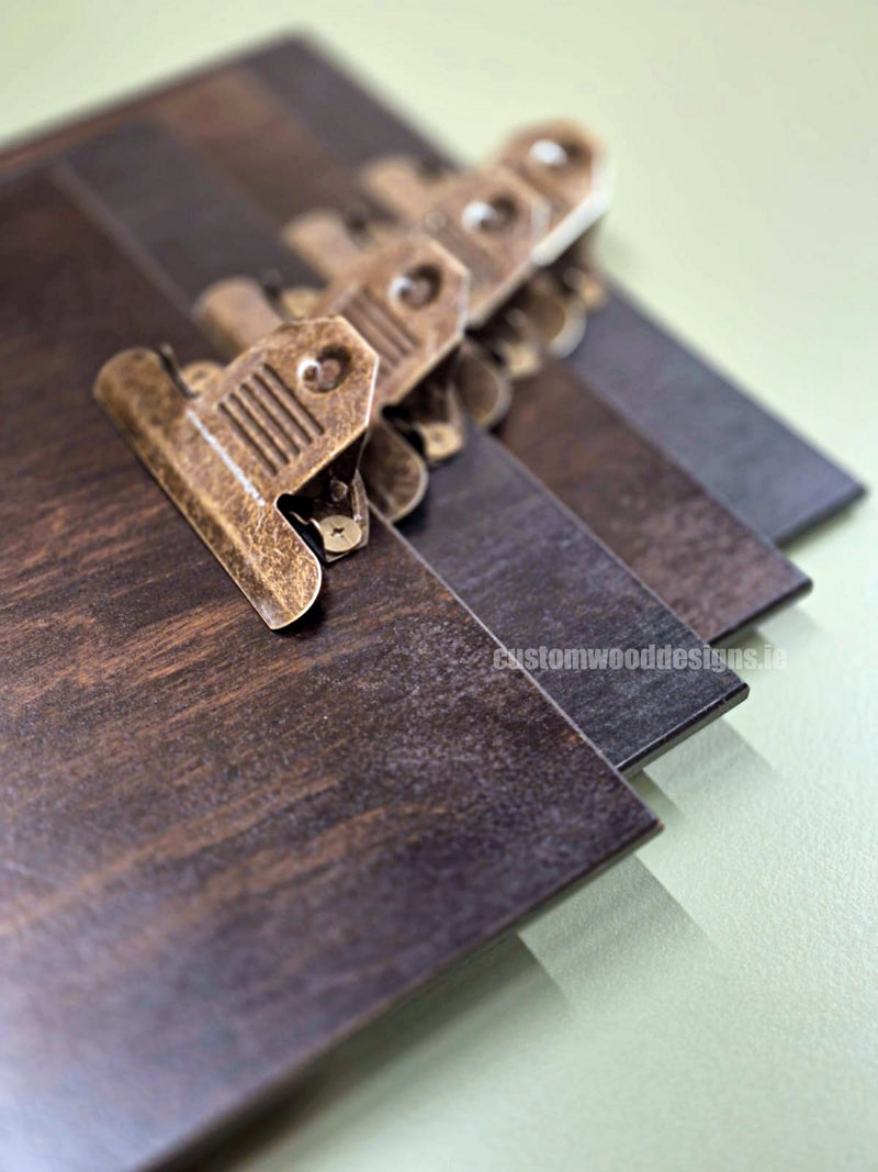 Load image into Gallery viewer, Set of 24 branded wooden A4 clipboards by Custom Wood Designs, displayed on a hospitality or hotel menu stand.