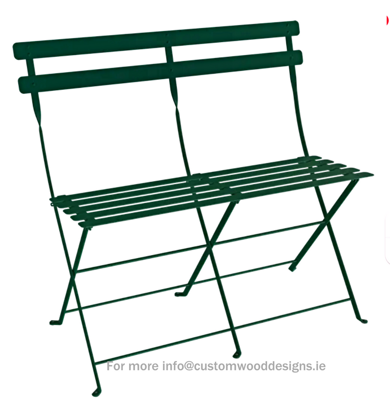 Load image into Gallery viewer, Cedar green Fermob Bistro two-seater folding ottoman bench with wooden legs and cushioned top for outdoor seating.