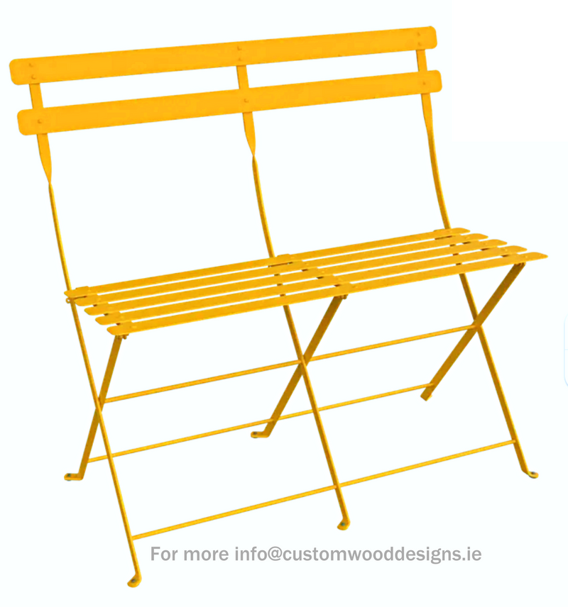 Load image into Gallery viewer, Fermob honey-colored two-seater folding ottoman bench with wooden legs and fabric cushion, ideal for outdoor or indoor use.