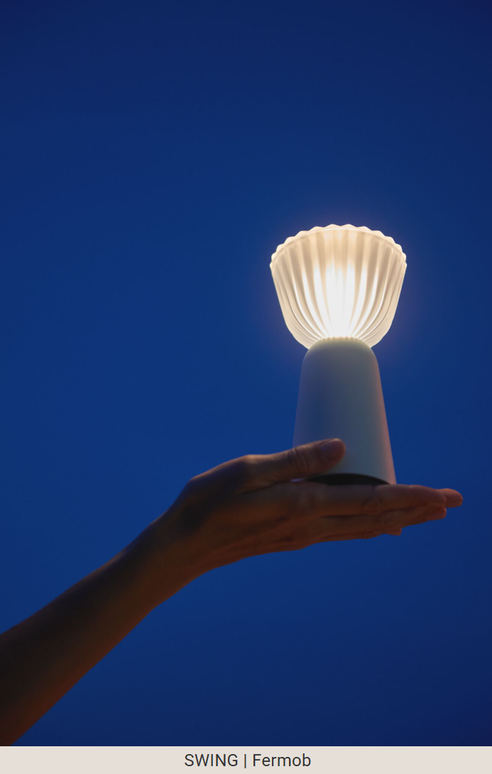 Load image into Gallery viewer, Set of six Fermob Swing rechargeable outdoor lamps with charging tray, stylish portable lighting for outdoor spaces.
