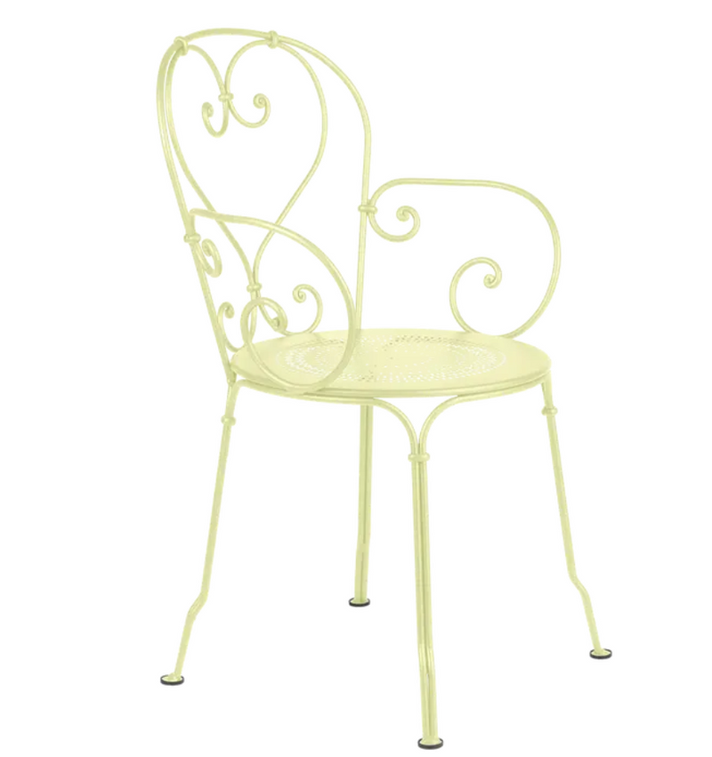 Load image into Gallery viewer, Fermob 1900 Lounge Armchair with yellow woven seat and metal frame, outdoor patio furniture setting.