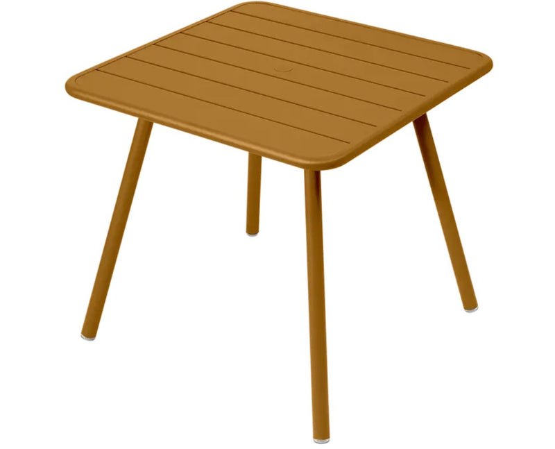 Load image into Gallery viewer, Fermob Luxembourg 4-leg garden table with an 80x80 cm metal top, featuring a modern design and sturdy construction.