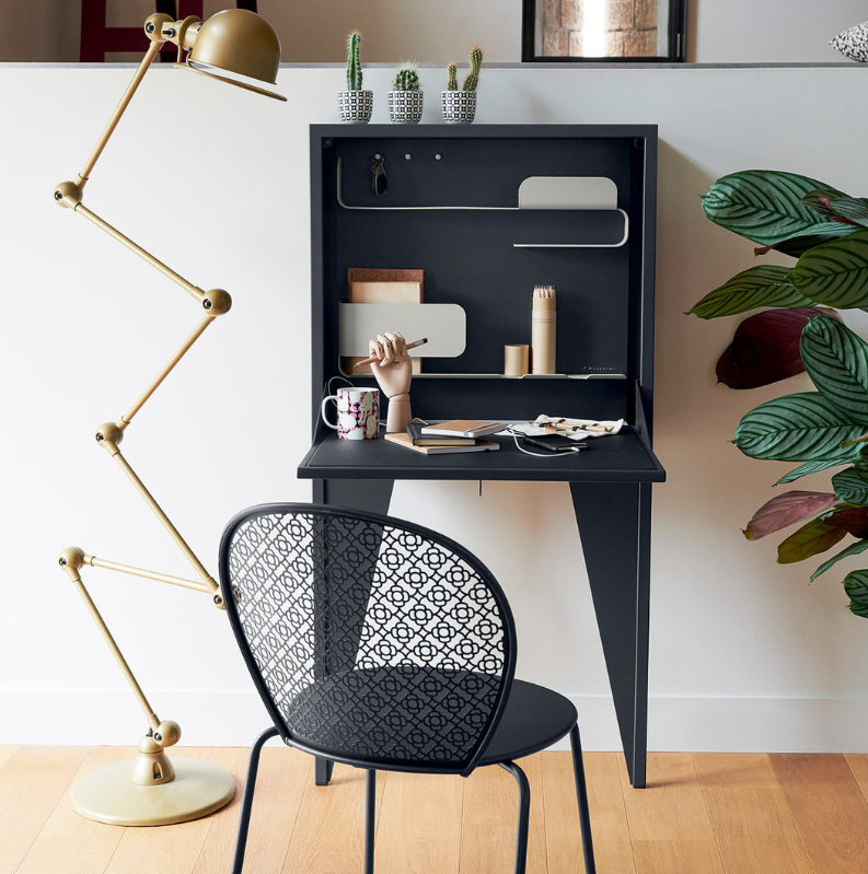 Wall-mounted Fermob Face à Face writing desk with a honey-colored wooden surface and sleek modern design.