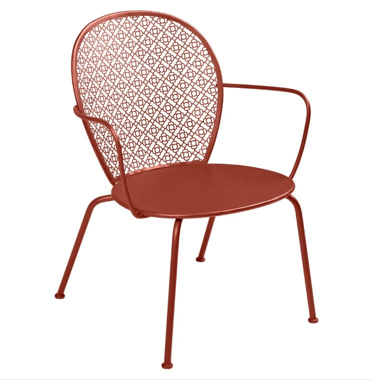 Load image into Gallery viewer, Fermob Lorette low metal armchair with a curved backrest, ideal for outdoor seating and hospitality settings.