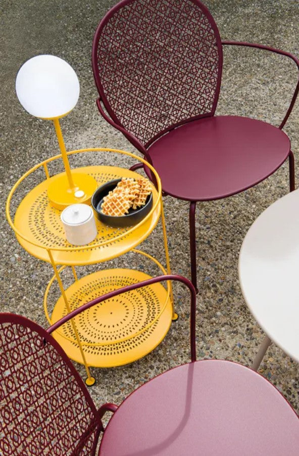 Load image into Gallery viewer, Fermob LORETTE low metal armchair with a curved backrest, suitable for outdoor seating and hotel or hospitality settings.