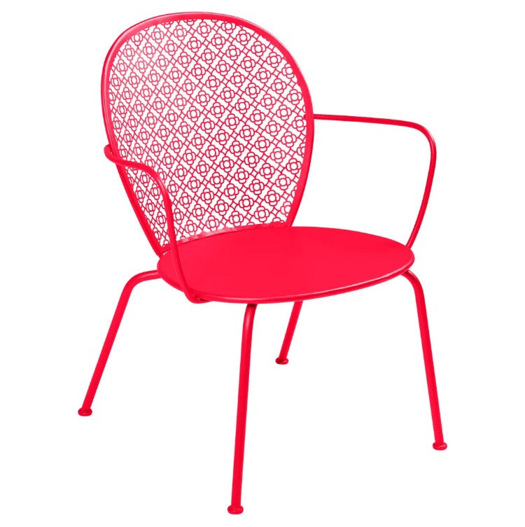 Load image into Gallery viewer, Fermob Lorette low armchair with metal frame and curved design, suitable for outdoor living and hospitality settings.