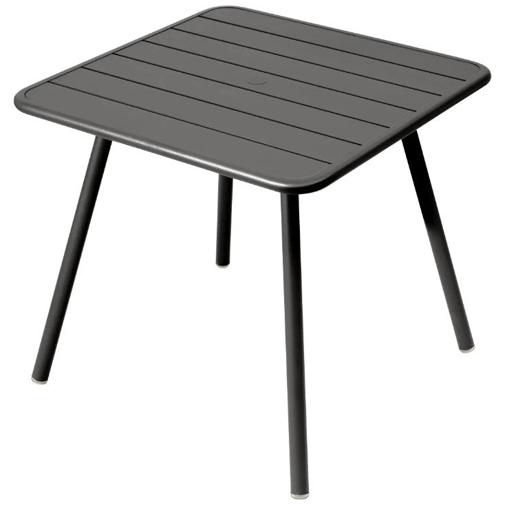 Load image into Gallery viewer, Fermob Luxembourg 4-leg garden table in dark grey metal, 80x80 cm, suitable for outdoor patio or garden use.