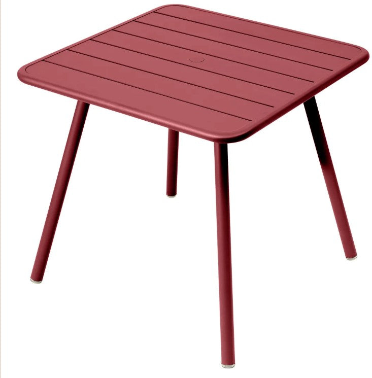 Load image into Gallery viewer, Fermob Luxembourg 4-leg garden table, 80x80 cm, metal with muted red aluminum finish, outdoor furniture for patio or garden.