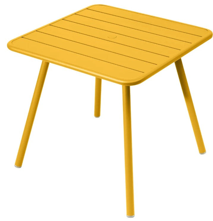 Load image into Gallery viewer, Orange Fermob Luxembourg 4-leg metal garden table, 80x80 cm, made of durable aluminum for outdoor use.