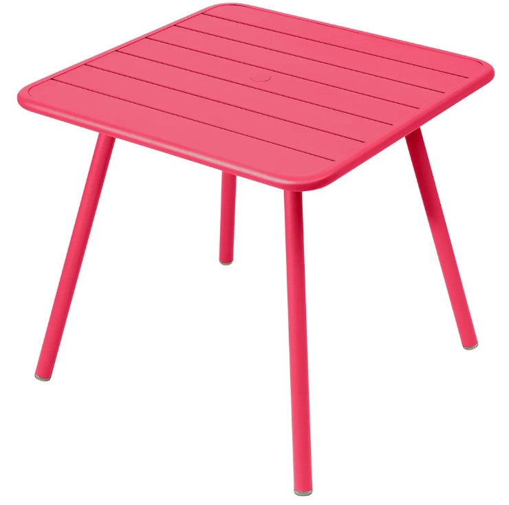 Load image into Gallery viewer, Fermob Luxembourg 4-leg metal garden table, 80x80 cm, pink aluminum with a modern outdoor design.
