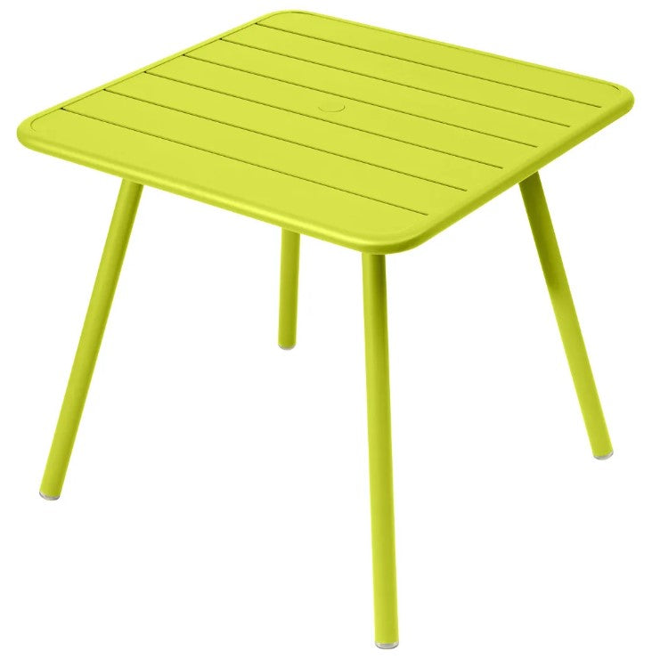 Load image into Gallery viewer, Fermob Luxembourg 4-leg metal garden table with 80x80 cm aluminum top in vibrant Verbena color.