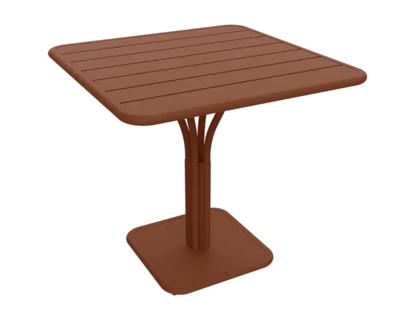 Load image into Gallery viewer, Dark red Fermob Luxembourg Pedestal Outdoor Table, 80x80 cm, showcasing its sturdy design and vibrant finish for outdoor spaces.