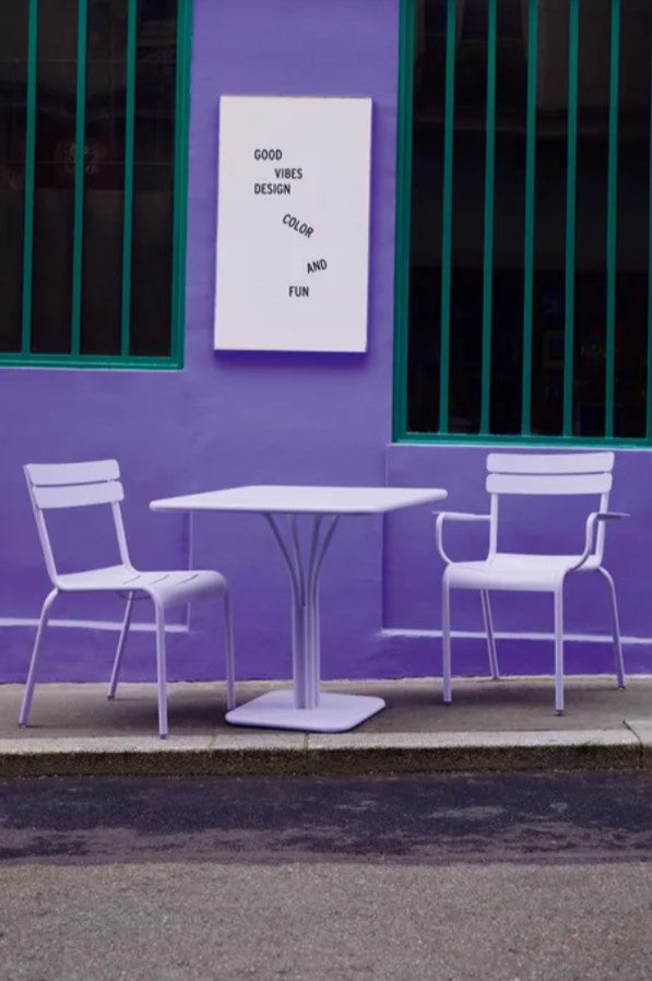 Load image into Gallery viewer, Fermob Luxembourg outdoor pedestal table in purple with 80x80 cm square top, suitable for garden or patio use.