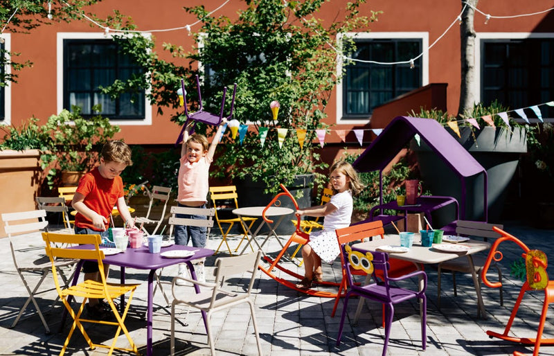 Load image into Gallery viewer, Fermob Luxembourg Kid Table with colorful children’s table and matching restaurant chair for kids' play and activities.