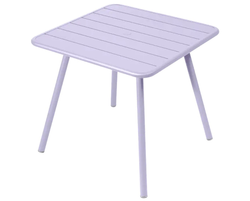 Load image into Gallery viewer, Fermob Luxembourg 4-leg garden metal table, 80x80 cm, with a smooth white surface suitable for outdoor use.